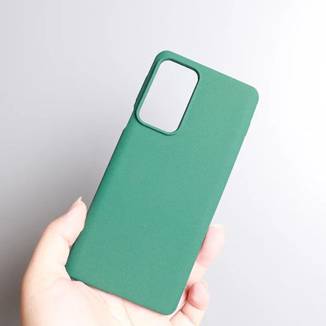 Green smartphone case held in a hand.