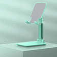 A green stand with a phone on it