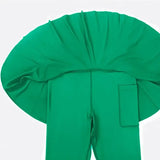 a green surgical gown with a large green hat