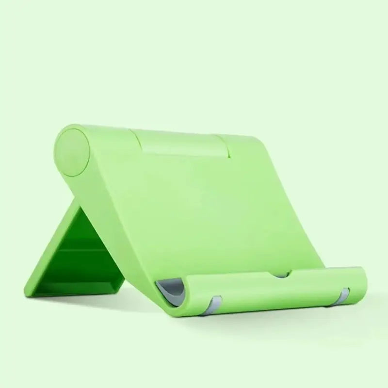 a green tablet stand with a white background