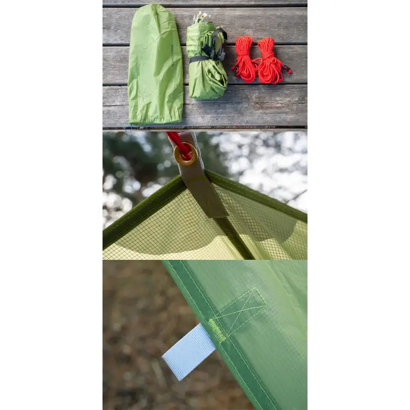 a green tent with a red string attached to it