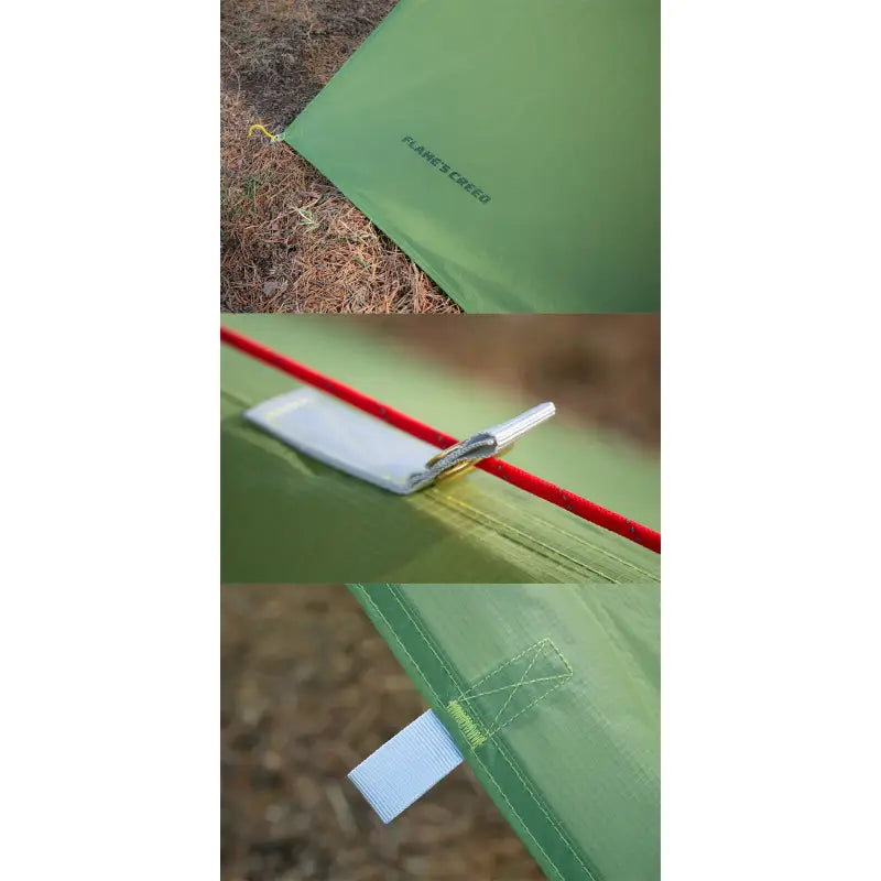 a green tent with a red pole and a white pole