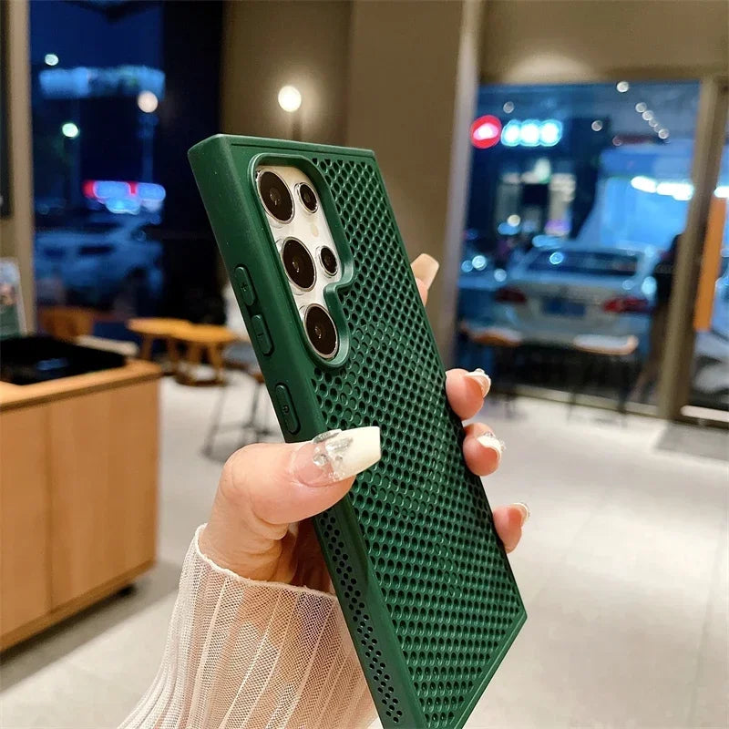 Green textured phone case with multiple camera cutouts, held in a hand.