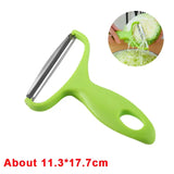 a green vegetable cutter with a knife and a knife