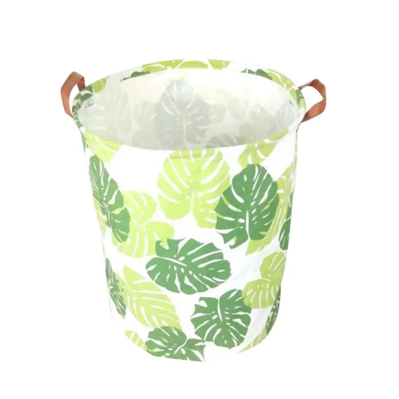 a green and white bucket with a leaf print