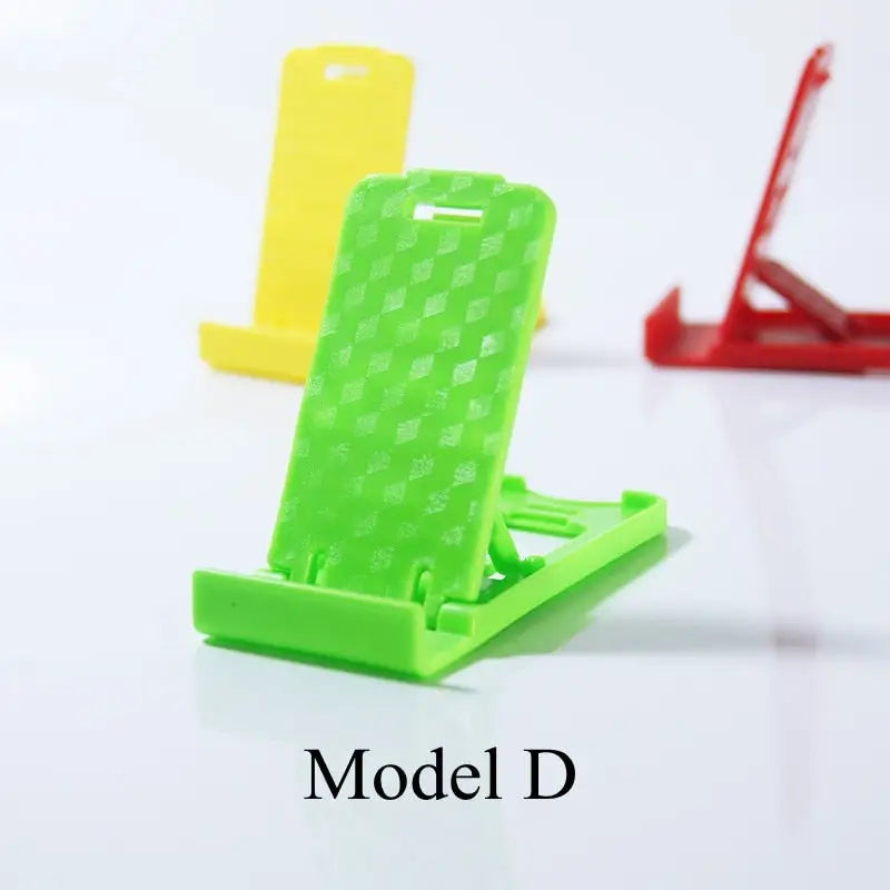 a green and yellow phone stand with the word model