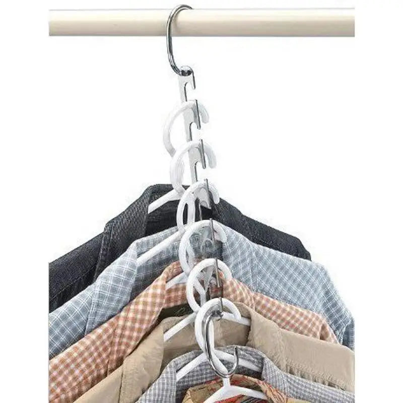 a white hanger with several shirts hanging on it