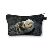 a small pouch bag with a baby sea otter in the water