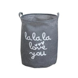 a grey laundry bag with the words love you