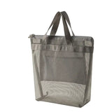 a grey mesh bag with a zipper closure