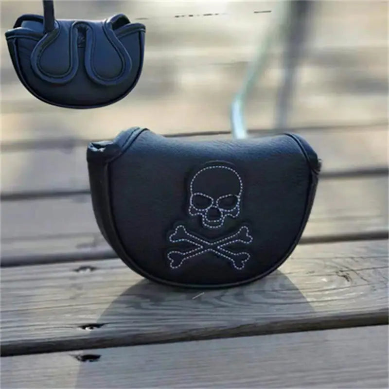 a black purse with a skull and crossbone on it