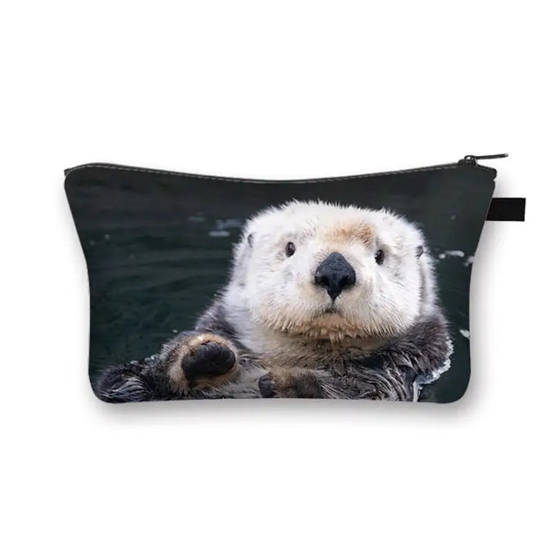 a close up of a small pouch with a sea otter on it