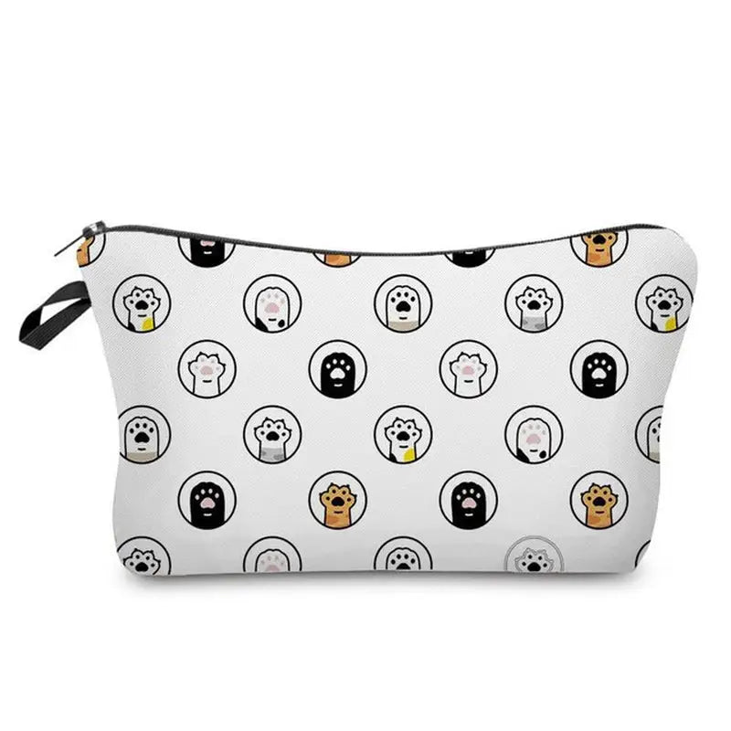 a white zipper bag with a pattern of dogs and cats