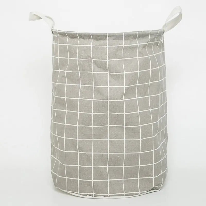 a grey and white laundry basket with a grid pattern