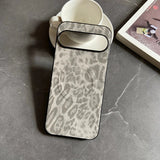 A grey and white leopard print phone case with a black border.