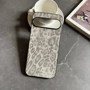 A grey and white leopard print phone case with a black border.
