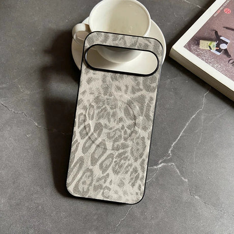 A grey and white leopard print phone case with a black border.