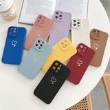 a group of four phone cases sitting on a table