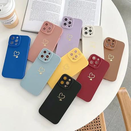 A group of four phone cases sitting on a table