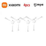 A group of four white and black wall mounted lamps