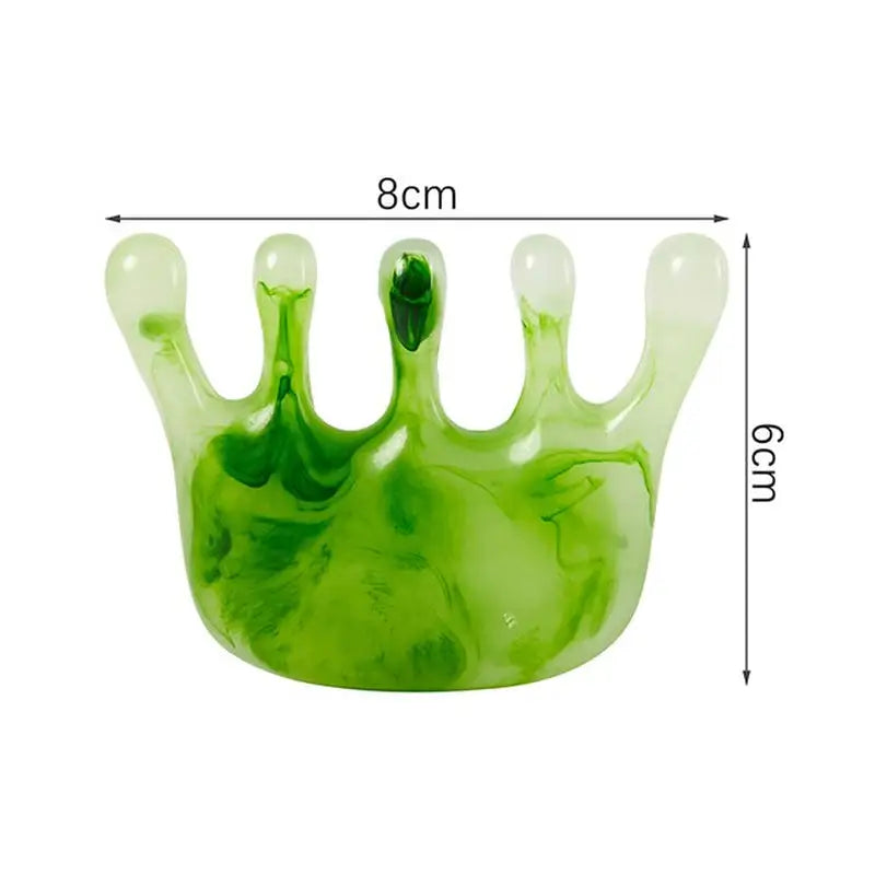 a green glass crown with a white background
