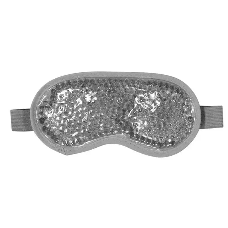 a silver eye mask with crystals on it