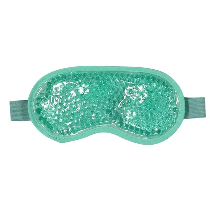 a green eye mask with seic crystals