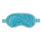 a close up of a blue eye mask with a blue beaded cover