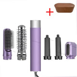 a close up of a hair dryer and a brush with a cup