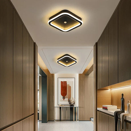 a hallway with wooden cabinets and a ceiling light