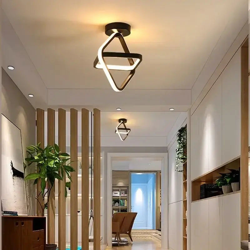 a hallway with a wooden floor and a light fixture