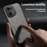 the back of a hand holding a black iphone case