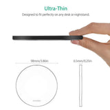 a hand holding a black pen with a white background