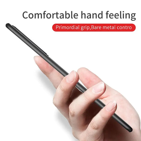 A hand holding a black pen with the words’comfortable and feeling ’