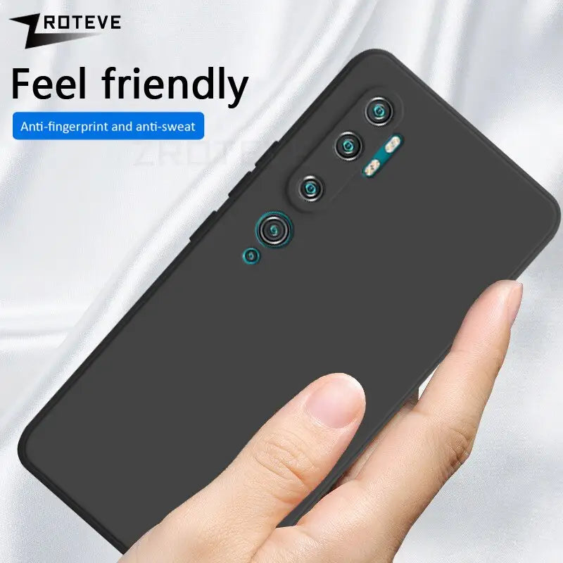 a hand holding a black phone case
