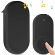 A hand holding a black wireless speaker