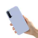 a hand holding a blue iphone case