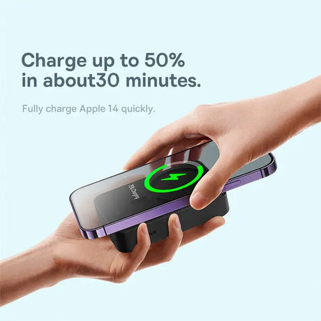 A hand holding a charger with a green arrow pointing towards it