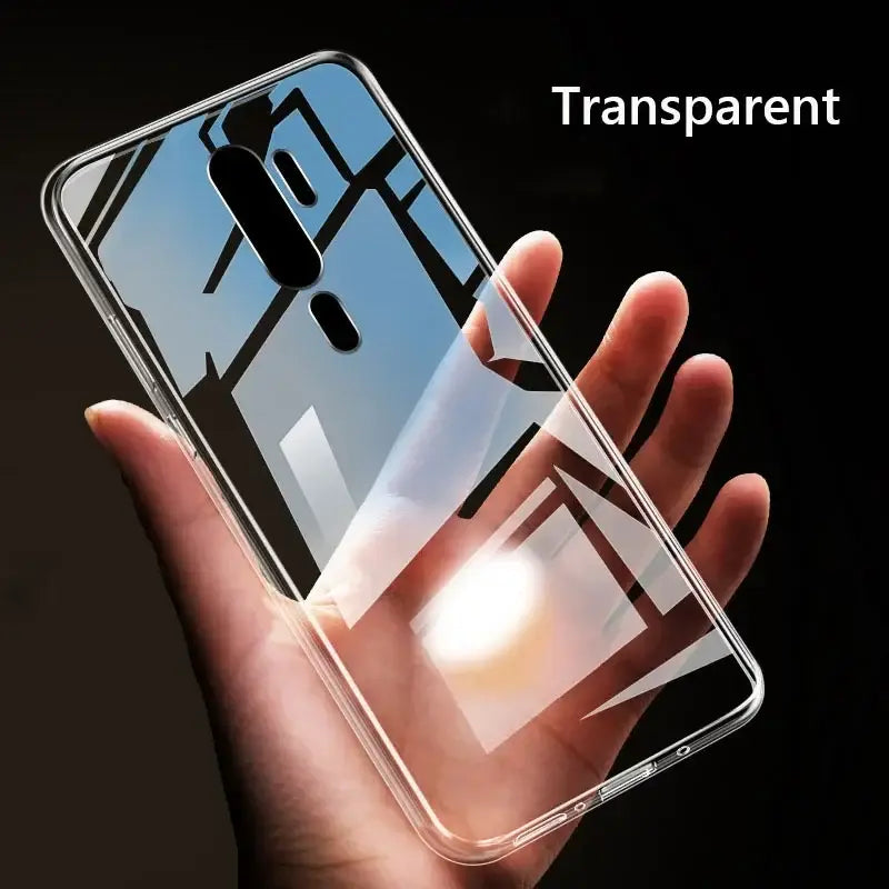 a hand holding a clear case with a transparent back
