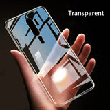 A hand holding a clear case with a transparent back