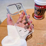 a hand holding a clear case with a white phone