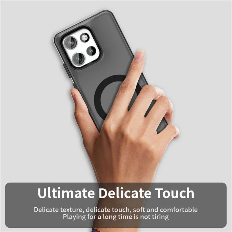 A hand holding a dark-colored smartphone with a clear case featuring a magnetic ring, highlighting its delicate texture and comfortable feel.