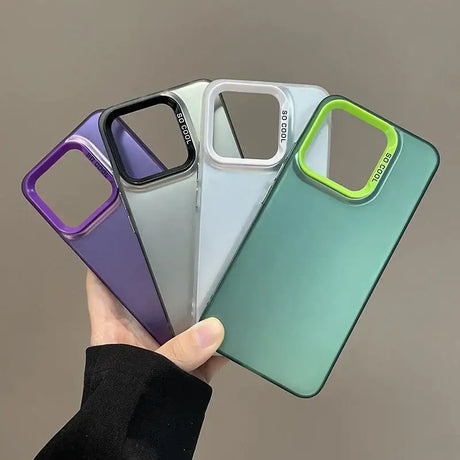 A hand holding four different colored cases