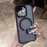 A hand holding a gray iPhone case with a black MagSafe ring and camera protection.