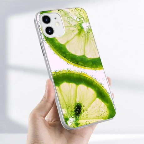 A hand holding a green liquid phone case