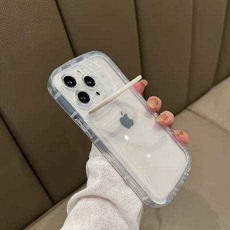 A hand holding an iphone case with a clear cover