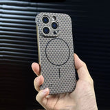 Hand holding a patterned smartphone case with visible camera cutouts and a MagSafe ring.