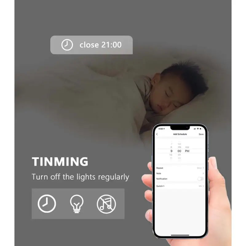 a hand holding a phone with a baby sleeping on it
