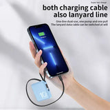 a hand holding a phone with a charging cable attached to it