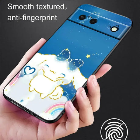 A hand holding a phone with a cartoon character on it